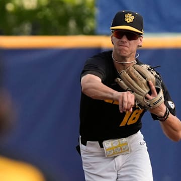 May 20, 2025; Hoover, AL, USA; Missouri shortstop 	Jackson Lovich throws to first for an out against Alabama in the first game of the SEC Baseball Tournament at the Hoover Met.