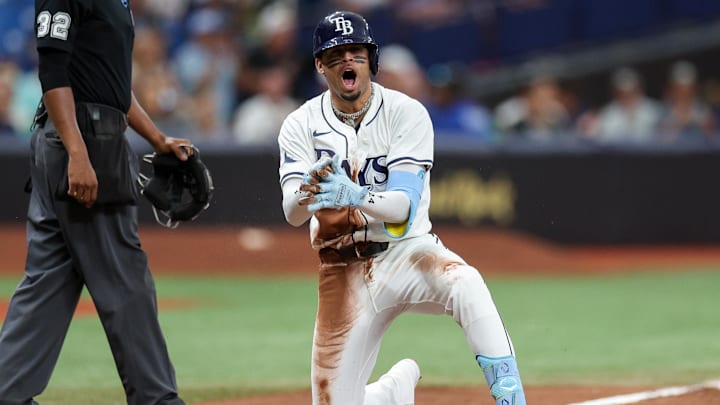 Sep 5, 2024; St. Petersburg, Florida, USA; Tampa Bay Rays second baseman Christopher Morel (24) triples against the Minnesota Twins in the eighth inning at Tropicana Field. Mandatory Credit: Nathan Ray Seebeck-Imagn Images