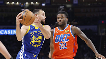 Nov 10, 2024; Oklahoma City, Oklahoma, USA; Golden State Warriors guard Stephen Curry (30) moves the ball down the court against Oklahoma City Thunder guard Cason Wallace (22) during the second half at Paycom Center. Mandatory Credit: Alonzo Adams-Imagn Images
