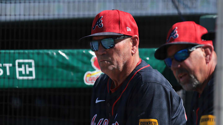 Feb 28, 2025; Jupiter, Florida, USA; Atlanta Braves manager Brian Snitker (43) watches the game against the Miami Marlins during the fifth inning at Roger Dean Chevrolet Stadium. Mandatory Credit: Sam Navarro-Imagn Images