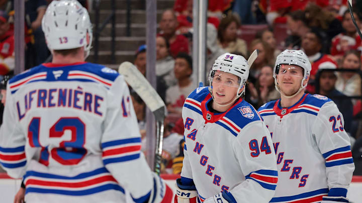 Apr 13, 2026; Sunrise, Florida, USA; New York Rangers right wing Gabe Perreault (94) celebrates with left wing Alexis Lafreniere (13) after scoring against the Florida Panthers during the second period at Amerant Bank Arena.