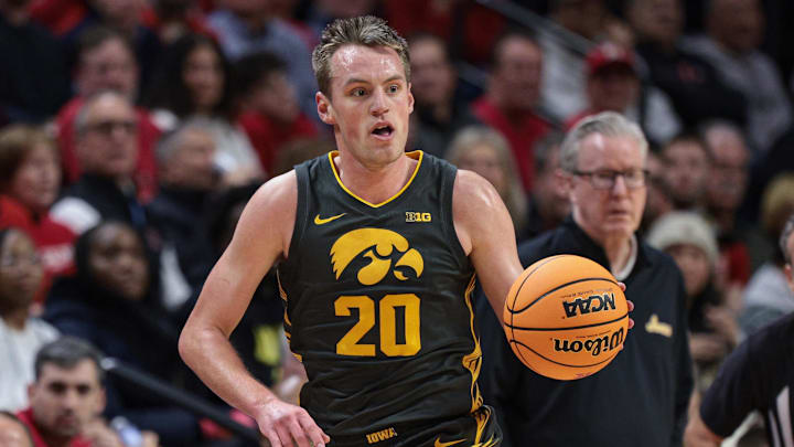 Iowa is a double-digit underdog to Maryland in Sunday's college basketball action.