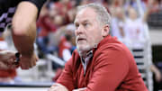 Arkansas Razorbacks athletics director Hunter Yurachek talks to an official during the game against the Hofstra Pride at Simmons Bank Arena in North Little Rock, Ark.