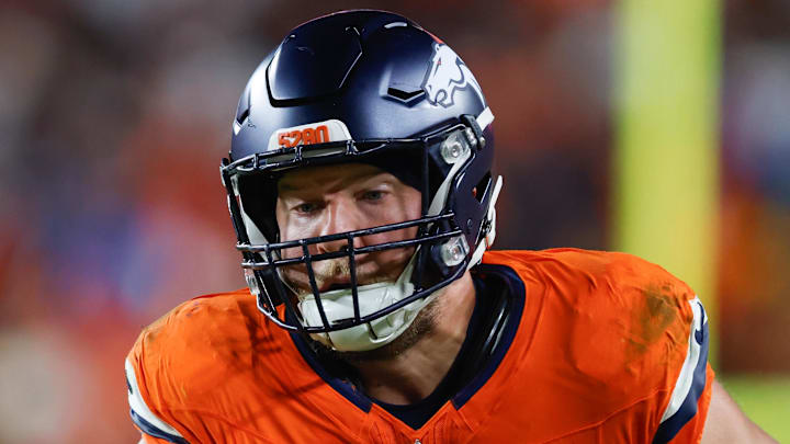 Nov 30, 2025; Landover, Maryland, USA; Denver Broncos tight end Adam Trautman (82) carries the ball after a reception against the Washington Commanders in the second quarter of the game at Northwest Stadium. Mandatory Credit: Peter Casey-Imagn Images
