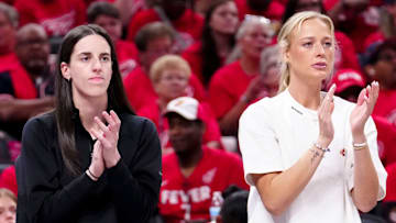 Indiana Fever forward Chloe Bibby (55), guard Caitlin Clark (22) and guard Sophie Cunningham (8) cheer during Game 4 of the WNBA semifinals on Sunday, Sept. 28, 2025, at Gainbridge Fieldhouse in Indianapolis. The Fever defeated the Aces 90-83.