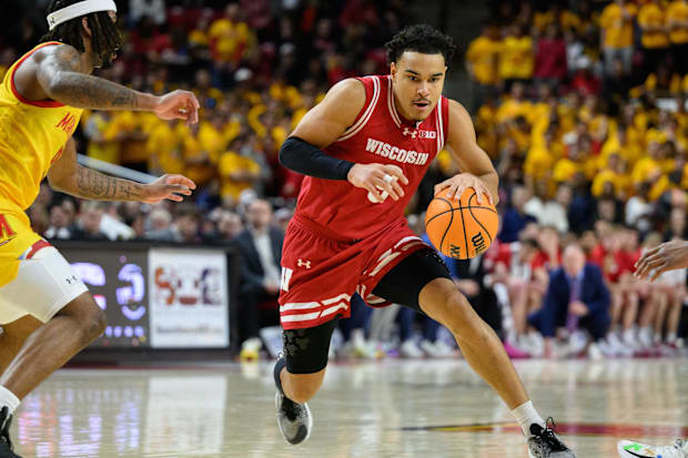 Jan 29, 2025; College Park, Maryland, USA; Wisconsin Badgers guard John Tonje (9) drives to the basket during the first half 