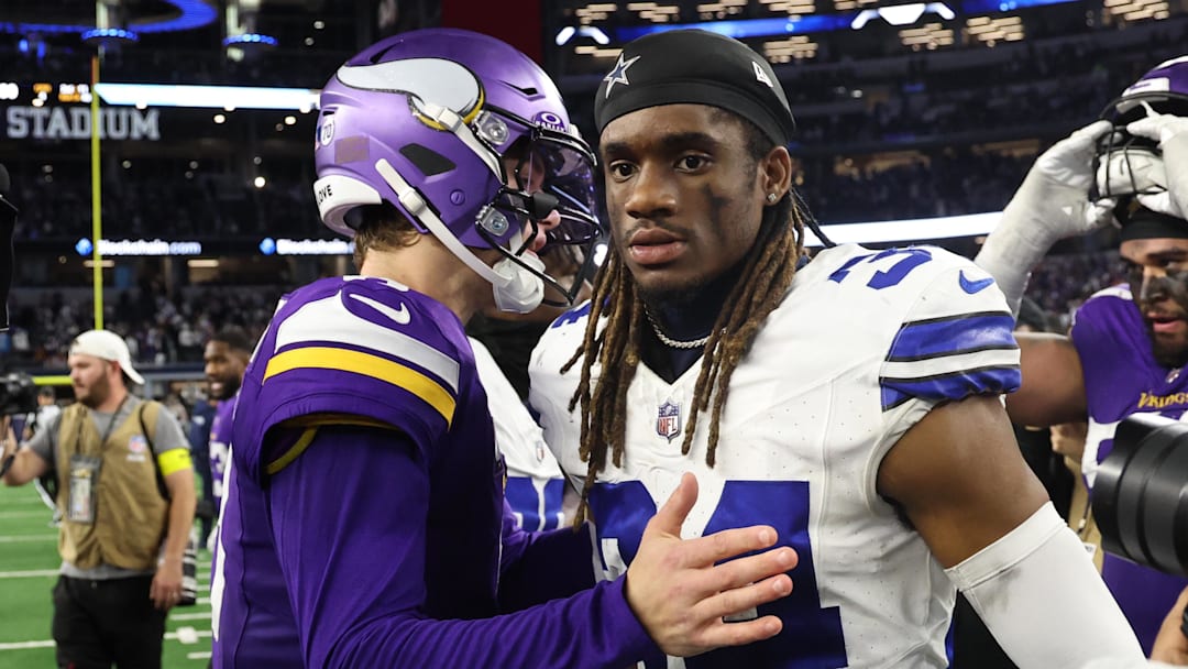 Dec 14, 2025; Arlington, Texas, USA; Minnesota Vikings quarterback J.J. McCarthy (9) talks to Dallas Cowboys cornerback Shavon Revel Jr. (34) after a game at AT&T Stadium. Mandatory Credit: Kevin Jairaj-Imagn Images