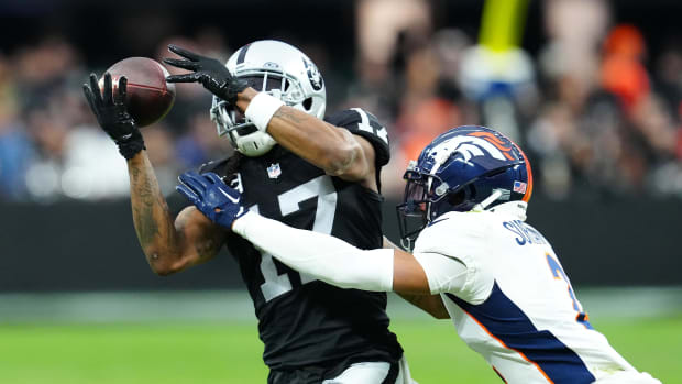 Las Vegas Raiders wide receiver Davante Adams (17) makes a catch against Denver Broncos cornerback Pat Surtain I