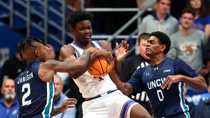 Kansas basketball guard Rakease Passmore (4) fights for the ball