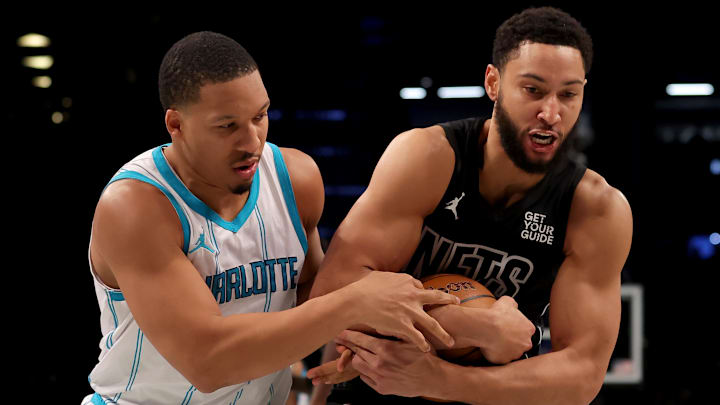 Ben Simmons and Grant Williams wrestle for the basketball. Ben Simmons and Grant Williams wrestle for the basketball.