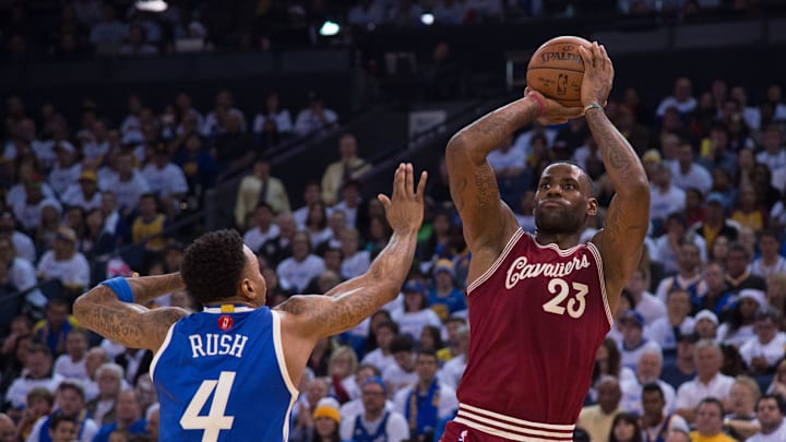 Then-Cavaliers forward LeBron James shoots against Warriors forward Brandon Rush during the 2015 Christmas game. The Warriors won, 89–83.