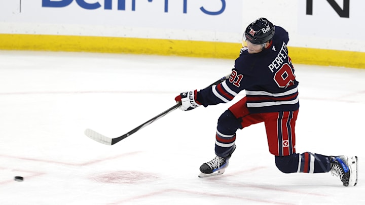 Oct 20, 2024; Winnipeg, Manitoba, CAN; Winnipeg Jets center Cole Perfetti (91) warms up before a game against the Pittsburgh Penguins at Canada Life Centre. Mandatory Credit: James Carey Lauder-Imagn Images