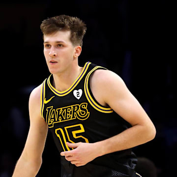 Feb 8, 2024; Los Angeles, California, USA; Los Angeles Lakers guard Austin Reaves (15) reacts after a three-point basket during the fourth quarter against the Denver Nuggets at Crypto.com Arena. Mandatory Credit: Jason Parkhurst-Imagn Images