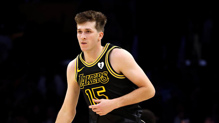 Feb 8, 2024; Los Angeles, California, USA; Los Angeles Lakers guard Austin Reaves (15) reacts after a three-point basket during the fourth quarter against the Denver Nuggets at Crypto.com Arena. Mandatory Credit: Jason Parkhurst-Imagn Images