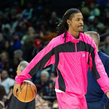 Mar 6, 2024; Philadelphia, Pennsylvania, USA; Injured Memphis grizzlies guard Ja Morant (12) dribbles the ball during a timeout in the third quarter against the Philadelphia 76ers at Wells Fargo Center. Mandatory Credit: Bill Streicher-Imagn Images