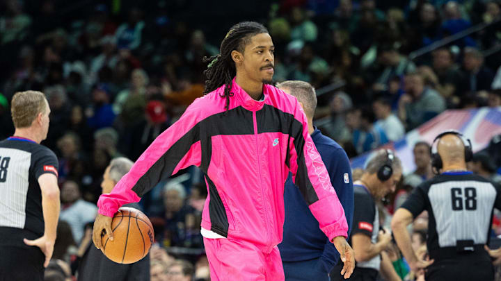 Mar 6, 2024; Philadelphia, Pennsylvania, USA; Injured Memphis grizzlies guard Ja Morant (12) dribbles the ball during a timeout in the third quarter against the Philadelphia 76ers at Wells Fargo Center. Mandatory Credit: Bill Streicher-Imagn Images