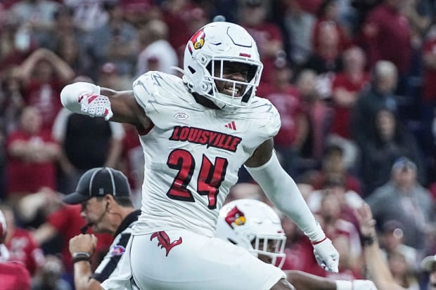 Louisville Cardinals linebacker Jaylin Alderman (24) celebrates stopping Indiana Hoosiers on downs on the goal line