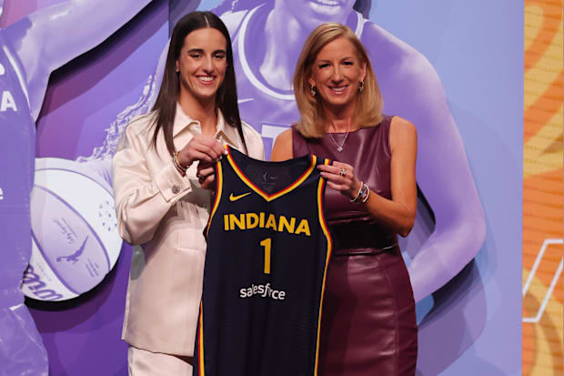 Caitlin Clark poses with WNBA commissioner Cathy Engelbert. 