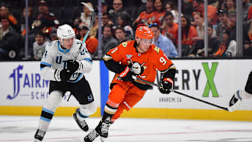 Sep 22, 2025; Anaheim, California, USA; Anaheim Ducks center Leo Carlsson (91) moves the puck ahead of Utah Mammoth center Cole Beaudoin (24) during the second period at Honda Center. Mandatory Credit: Gary A. Vasquez-Imagn Images