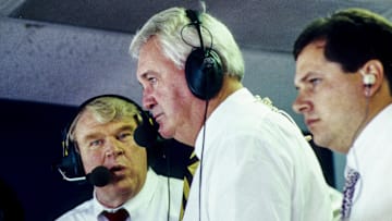 Oct 9, 1988: St. Louis, MO, USA; FILE PHOTO; Former Oakland Raider head coach John Madden (left) and commentator Pat Summerall (right) at Texas Stadium during the regular season gem between the Dallas Cowboys and the Washington Redskins. 