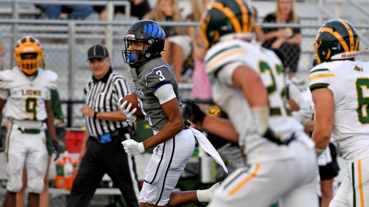 Decatur runs after the catch against Queen Anne's 