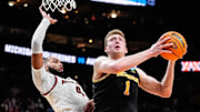 Michigan center Danny Wolf (1) goes to the basket against Auburn forward Johni Broome (4) during the second half of the Sweet 16 round of NCAA tournament at State Farm Arena in Atlanta, Ga. on Friday, March 28, 2025.