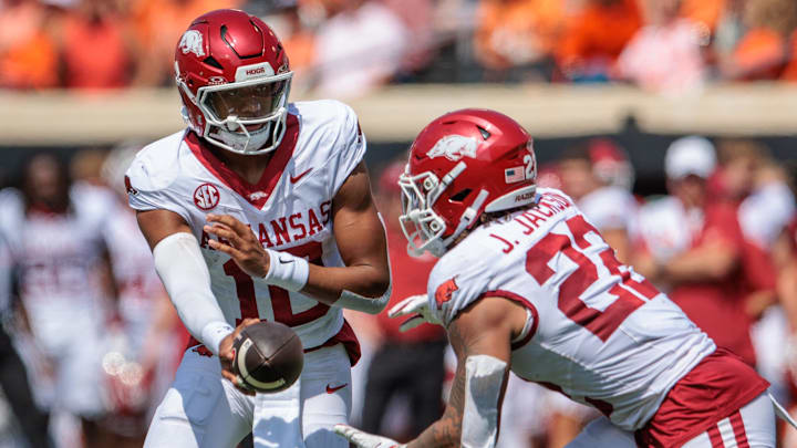 Sep 7, 2024; Stillwater, Oklahoma, USA; Arkansas Razorbacks quarterback Taylen Green (10) hands off to Arkansas Razorbacks running back Ja'Quinden Jackson (22) during the second quarter against the Oklahoma State Cowboys at Boone Pickens Stadium. Mandatory Credit: William Purnell-Imagn Images