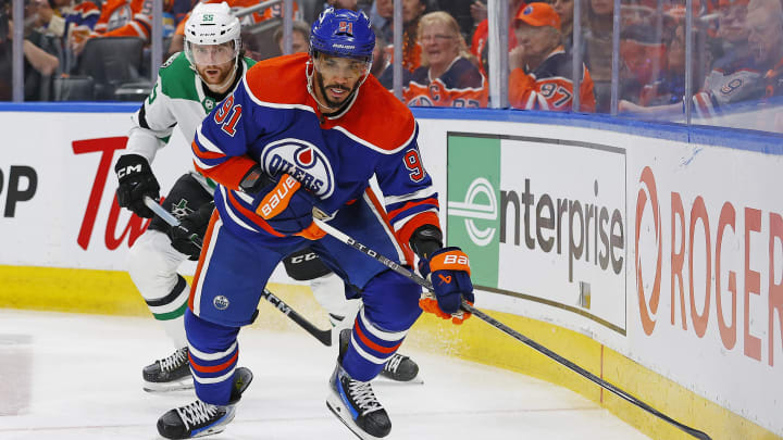 May 29, 2024; Edmonton, Alberta, CAN; Edmonton Oilers forward Evander Kane (91) looks to make a pass in front of Dallas Stars defensemen Thomas Harley (55) during the third period in game four of the Western Conference Final of the 2024 Stanley Cup Playoffs at Rogers Place. Mandatory Credit: Perry Nelson-USA TODAY Sports