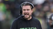 Oct 25, 2025; Eugene, Oregon, USA; Oregon Ducks head coach Dan Lanning instructs players during the first half against the Wisconsin Badgers at Autzen Stadium. Mandatory Credit: Troy Wayrynen-Imagn Images