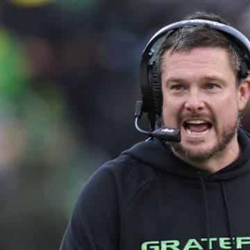 Oct 25, 2025; Eugene, Oregon, USA; Oregon Ducks head coach Dan Lanning instructs players during the first half against the Wisconsin Badgers at Autzen Stadium. Mandatory Credit: Troy Wayrynen-Imagn Images