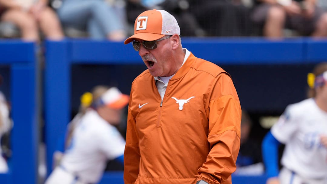 Texas Longhorns head coach Mike White shouts during a Women's College World Series softball game.