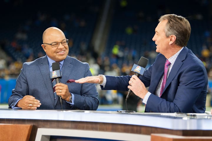 NBC Sports broadcasters Mike Tirico and Cris Collinsworth speak before a game between the Detroit Lions and the Pittsburgh St