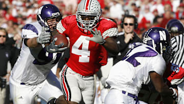 Nov  12, 2005; Columbus, OH, USA; Ohio State Buckeyes receiver #4 Santonio Holmes runs against Northwestern Wildcats defensive end #91 Mark Koehn at Ohio Stadium. Mandatory Credit: Photo By Matthew Emmons- Imagn Images Copyright © 2005 Matthew Emmons