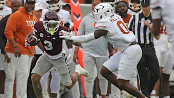 Mississippi State Bulldogs wide receiver Anthony Evans III runs after a catch as Texas Longhorns linebacker Anthony Hill Jr. attempts to make the tackle during the second quarter  at Davis Wade Stadium at Scott Field.