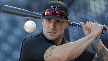 Sep 10, 2024; Pittsburgh, Pennsylvania, USA;  Miami Marlins manager Skip Schumaker (45) hits ground balls during batting practice before a game against the Pittsburgh Pirates at PNC Park. Mandatory Credit: Charles LeClaire-Imagn Images