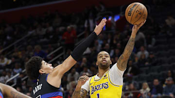 Nov 29, 2023; Detroit, Michigan, USA; Los Angeles Lakers guard D'Angelo Russell (1) shoots on Killian Hayes