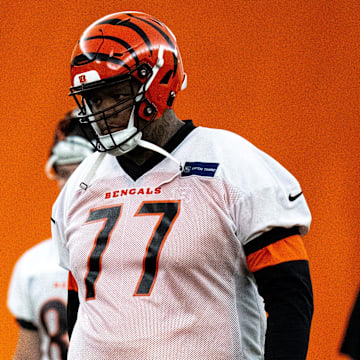 Cincinnati Bengals offensive tackle Trent Brown (77) walks to the line for field goal practice at Bengals spring practice at the IEL Indoor Facility in Cincinnati on Wednesday, June 12, 2024.