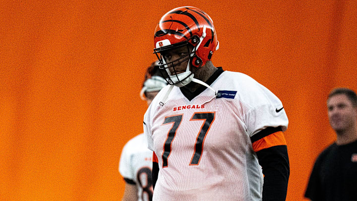 Cincinnati Bengals offensive tackle Trent Brown (77) walks to the line for field goal practice at Bengals spring practice at the IEL Indoor Facility in Cincinnati on Wednesday, June 12, 2024.