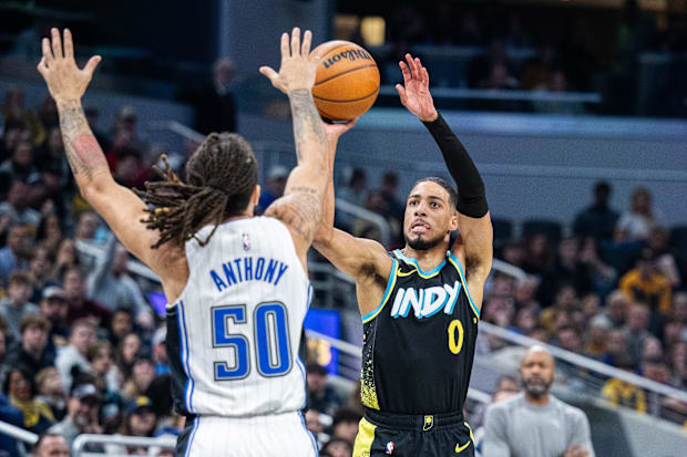 Tyrese Haliburton of the Indiana Pacers shoots over Cole Anthony of the Orlando Magic in an NBA gam