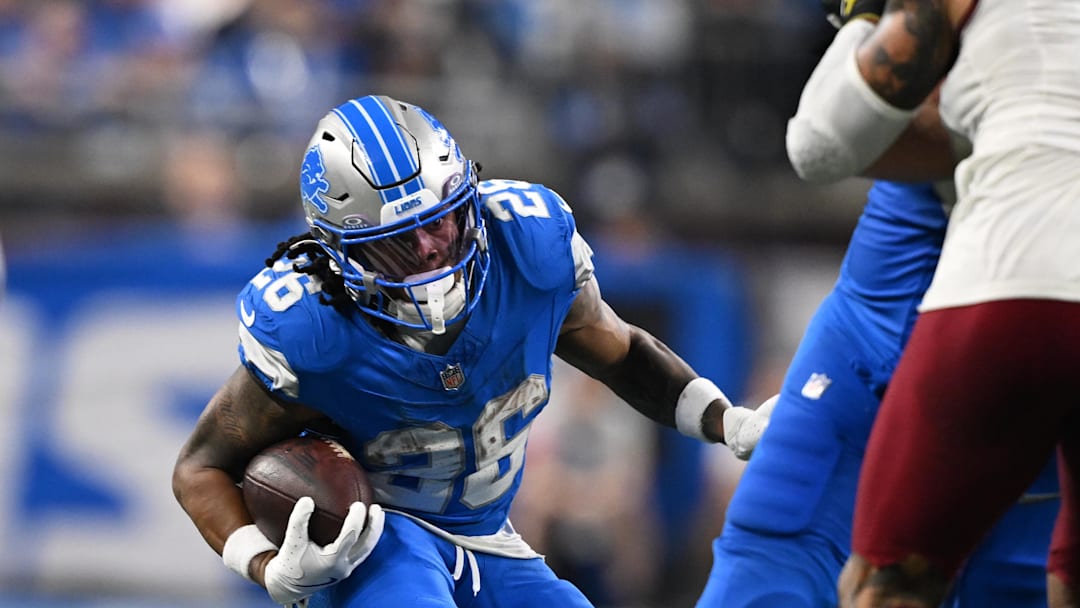 Jan 18, 2025; Detroit, Michigan, USA; Detroit Lions running back Jahmyr Gibbs (26) runs the ball during the third quarter against the Washington Commanders in a 2025 NFC divisional round game at Ford Field. Mandatory Credit: Lon Horwedel-Imagn Images