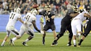 Jan 1, 2014; Glendale, AZ, USA; Baylor Bears quarterback Bryce Petty (14) looks for an open receiver to pass to during the fourth quarter against the UCF Knights at University of Phoenix Stadium during the Fiesta Bowl. The Knights won 52-42. Mandatory Credit: Casey Sapio-Imagn Images