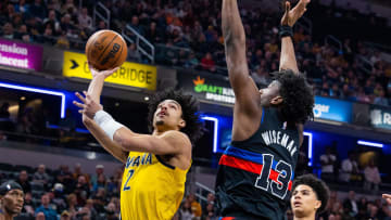 Apr 7, 2023; Indianapolis, Indiana, USA; Indiana Pacers guard Andrew Nembhard (2) shoots the ball while  Detroit Pistons center James Wiseman (13) defends in the first quarter at Gainbridge Fieldhouse. Mandatory Credit: Trevor Ruszkowski-USA TODAY Sports