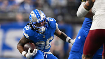 Jan 18, 2025; Detroit, Michigan, USA; Detroit Lions running back Jahmyr Gibbs (26) runs the ball during the third quarter against the Washington Commanders in a 2025 NFC divisional round game at Ford Field. Mandatory Credit: Lon Horwedel-Imagn Images