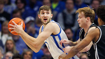 Dec 31, 2024; Lexington, Kentucky, USA; Kentucky Wildcats forward Andrew Carr (7) holds the ball during the first half against the Brown Bears at Rupp Arena at Central Bank Center. Mandatory Credit: Jordan Prather-Imagn Images