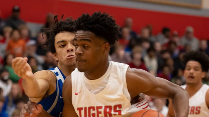 Fishers Tigers guard Jalen Haralson (10) dribbles past Hamilton Southeastern Royals forward Michael Griffith (21) on Friday, Dec. 16, 2022, at Fishers High School.

High School Basketball Hs Basketball Fishers Vs Hamilton Southeastern Hamilton Southeastern Royals At Fishers Tigers