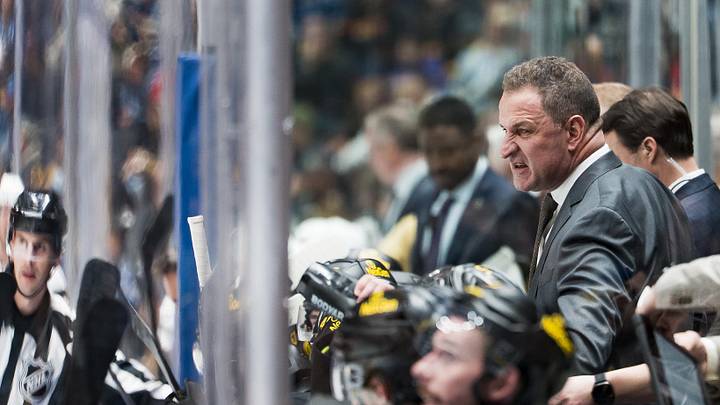 Apr 7, 2026; Vancouver, British Columbia, CAN; Vancouver Canucks head coach Adam Foote on the bench against the Vegas Golden Knights in the third period at Rogers Arena. Mandatory Credit: Bob Frid-Imagn Images