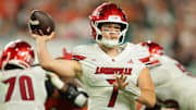 Oct 17, 2025; Miami Gardens, Florida, USA; Louisville Cardinals quarterback Miller Moss (7) throws the football against the Miami Hurricanes during the second quarter at Hard Rock Stadium. Mandatory Credit: Sam Navarro-Imagn Images