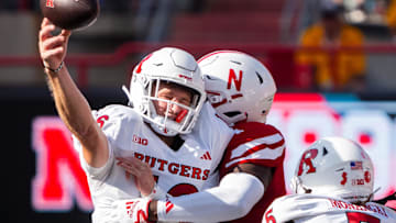 Rutgers quarterback Athan Kaliakmanis throws as he is hit by Nebraska linebacker Vincent Shavers Jr. on Oct. 5, 2024.