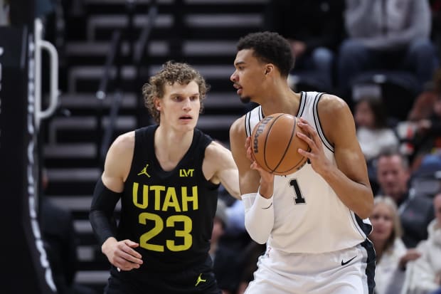 San Antonio Spurs center Victor Wembanyama (1) posts up against Utah Jazz forward Lauri Markkanen (23).