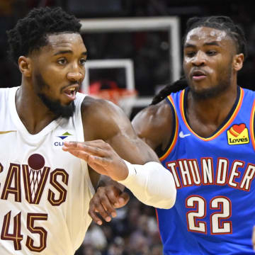 Oct 27, 2023; Cleveland, Ohio, USA; Cleveland Cavaliers guard Donovan Mitchell (45) moves against Oklahoma City Thunder guard Cason Wallace (22) in the third quarter at Rocket Mortgage FieldHouse. Mandatory Credit: David Richard-USA TODAY Sports